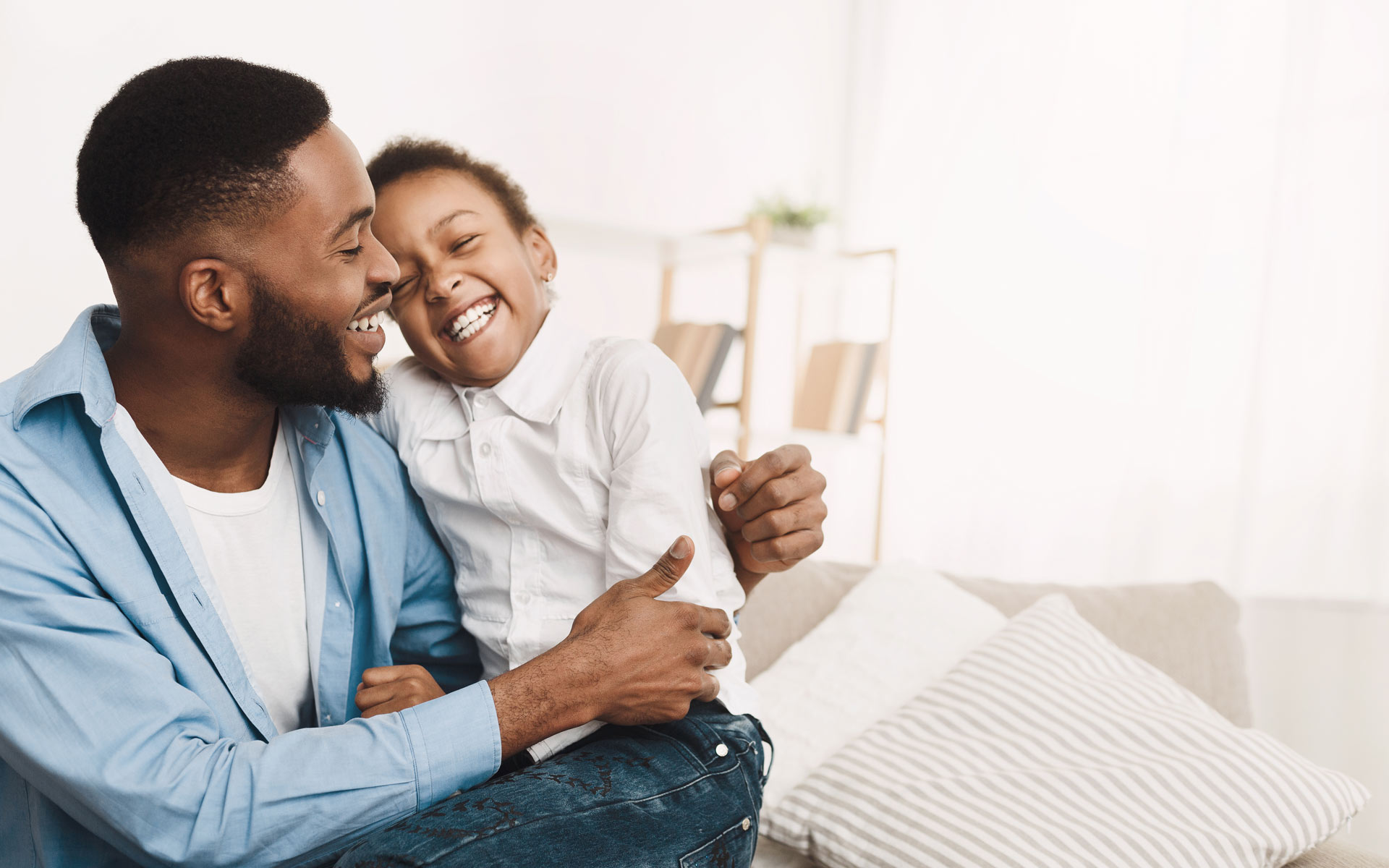 Father and daughter laughing